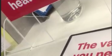 Woman politely asks a CVS pharmacist to pull a Moderna safety insert from package.  It’s blank!