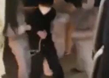 COVID stormtroopers force Chinese citizens to get on a bus that will take them to a quarantine camp.