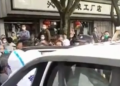 Old Chinese man gets arrested by COVID stormtroopers in the Qingpu District in Shanghai.