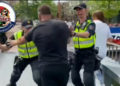 Child screams as Dutch police baton the public in Almelo who have gathered in support of the Dutch farmers mural reading “no farmers, no food” which the mayor has ordered to be removed.