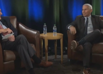 Fauci jokes that he created COVID in his kitchen and laughs.